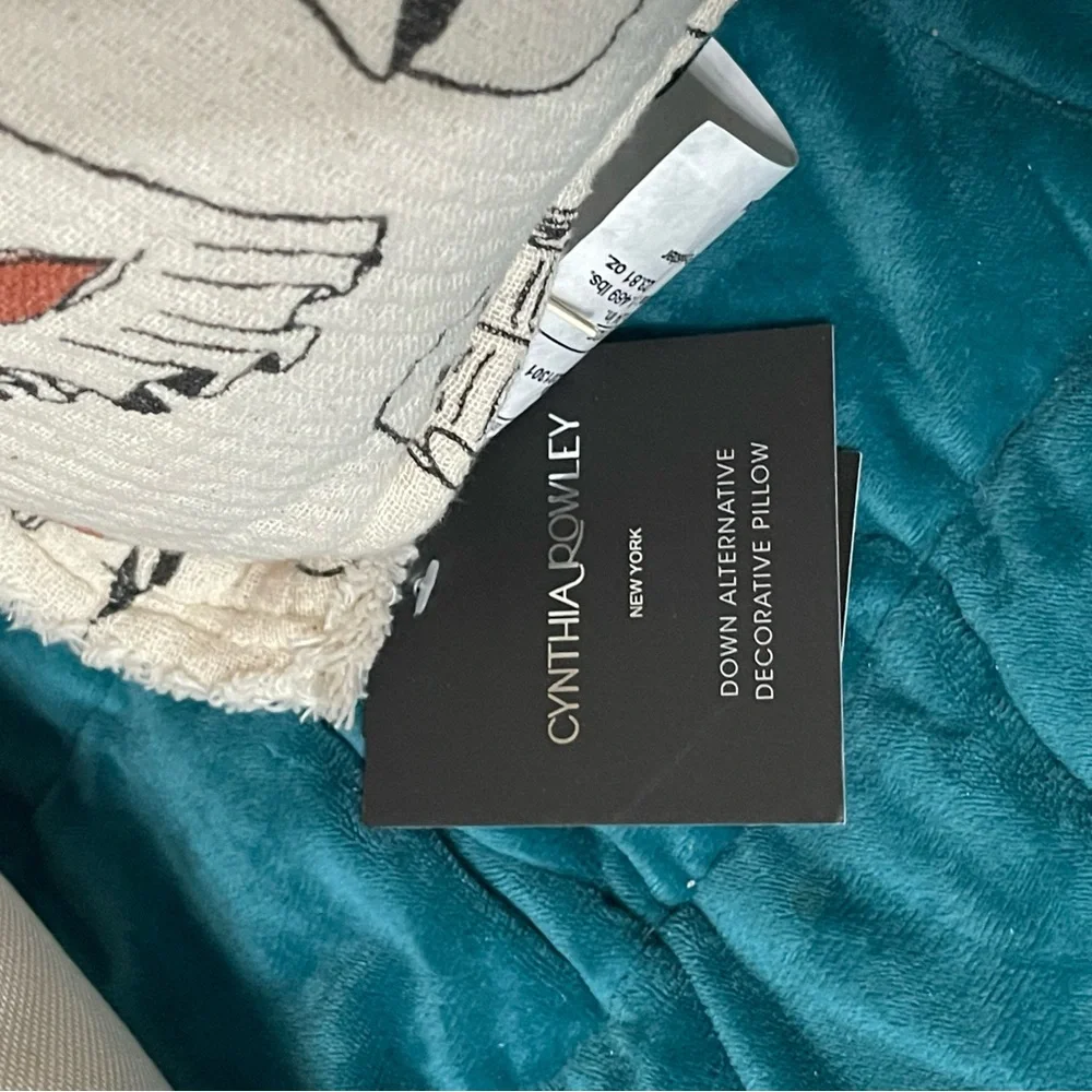 Ghost reading book pillow by Cynthia Rowley